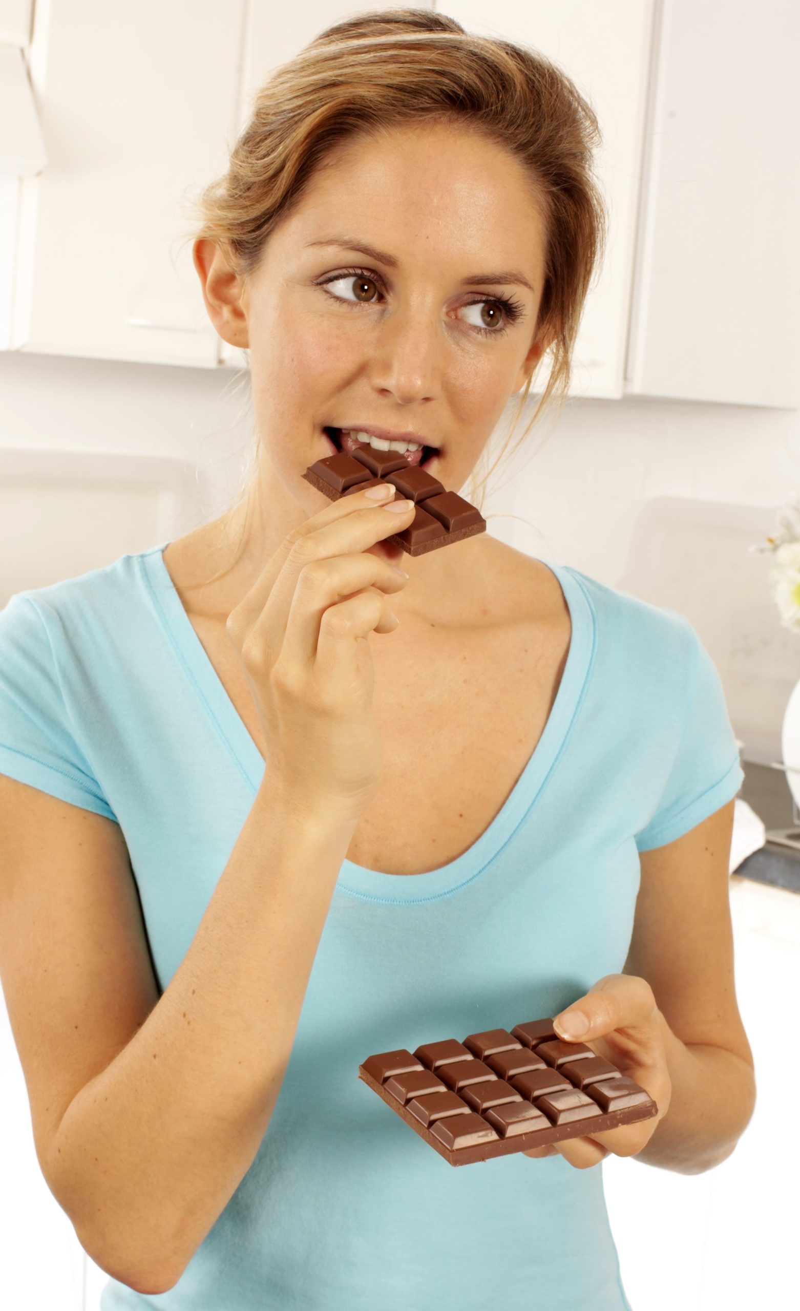 Girl Eating Bar of Chocolate