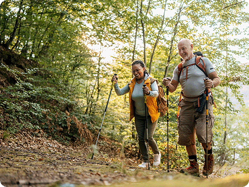 happy-couple-hiking-after-losing-weight-with-blue-sky-md-medical-weight-loss